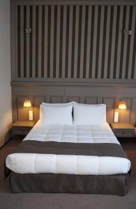 Postel nebo postele na pokoji v ubytování Rodopi Hotel