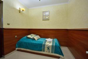 Uma cama ou camas num quarto em Api IV Zakopane