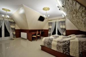 Uma cama ou camas num quarto em Api IV Zakopane