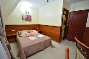 Uma cama ou camas num quarto em Api IV Zakopane