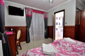 Uma cama ou camas num quarto em Api IV Zakopane