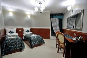 Uma cama ou camas num quarto em Api IV Zakopane