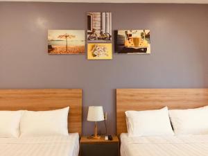 Ένα ή περισσότερα κρεβάτια σε δωμάτιο στο ENJOY HOME