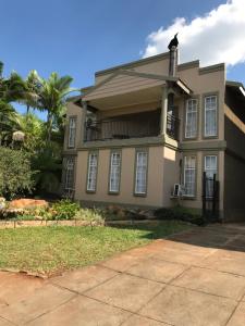 a house with a cat sitting on top of it at Komati Kruger Villas in Komatipoort