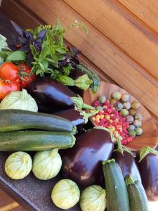 a bunch of vegetables sitting on a table at Maison d'Hôtes Zella in Bains de Guitera