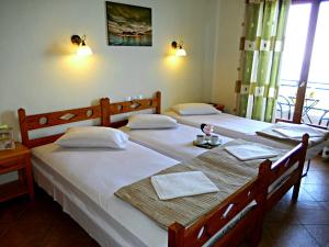 
Ένα ή περισσότερα κρεβάτια σε δωμάτιο στο Hotel Evripides
