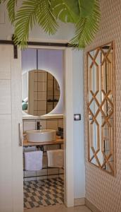 a bathroom with a sink and a mirror at Amita Hotel Boutique "Only adults" in Suances