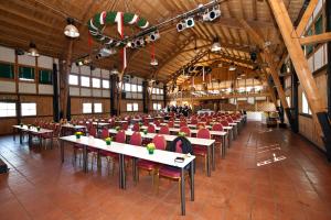 a large room with tables and chairs in it at Schloss Diedersdorf in Diedersdorf