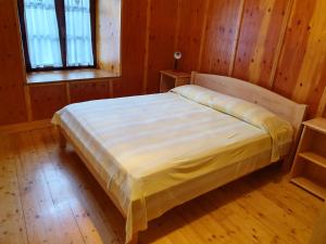 Posteľ alebo postele v izbe v ubytovaní Casa vacanze La Maddalena