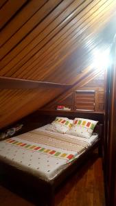 a bunk bed with two pillows on top of it at MADERA in Djamandjary