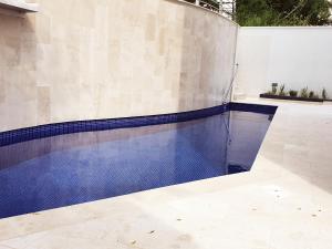 a swimming pool in a house with a pool at Hotel Pierina in Budva