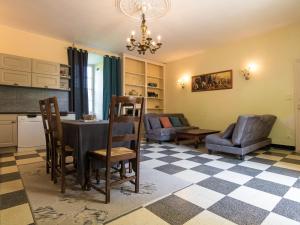 a kitchen and living room with a table and chairs at Heritage Castle in Chaleix with shared pool in Chaleix