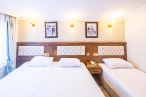 Postelja oz. postelje v sobi nastanitve Assos Kervansaray Hotel - Special Category