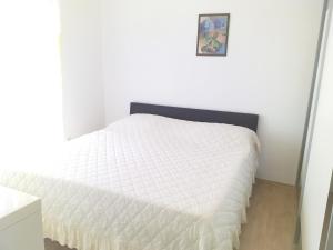Postel nebo postele na pokoji v ubytování Apartmani Ivan by the sea + 33 fotografií