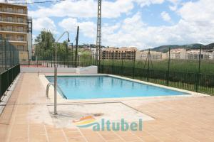 a swimming pool in the middle of a building at Edificio Esmeralda in Peniscola