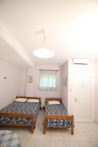 Letto o letti in una camera di Pavlidis