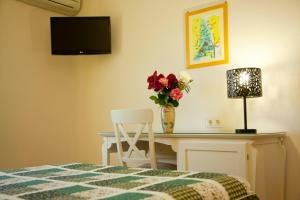 Posteľ alebo postele v izbe v ubytovaní Hostal Los Pinos