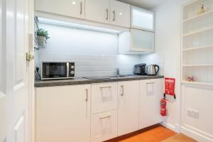 Kuchyň nebo kuchyňský kout v ubytování Barnes Fell Apartments