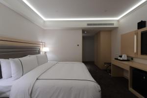 Voodi või voodid majutusasutuse K Hotel Taipei Songjiang toas