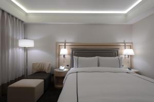 Voodi või voodid majutusasutuse K Hotel Taipei Songjiang toas
