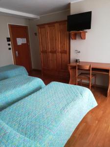 Ein Bett oder Betten in einem Zimmer der Unterkunft Hotel Holiday Debili
