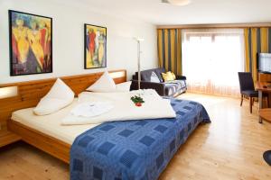 Postel nebo postele na pokoji v ubytování Hotel Binggl