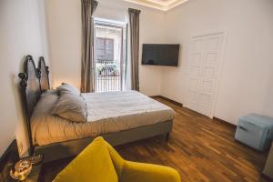 Postel nebo postele na pokoji v ubytování Suites of the Royal Council