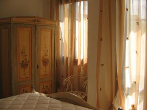 Ένα ή περισσότερα κρεβάτια σε δωμάτιο στο CASA PUTIFIGARI