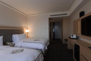 Voodi või voodid majutusasutuse K Hotel Taipei Songjiang toas