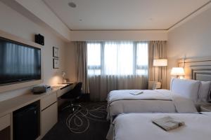 Voodi või voodid majutusasutuse K Hotel Taipei Songjiang toas