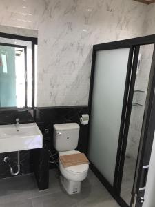 a bathroom with a toilet and a sink at Fine Times Resort in Ko Chang
