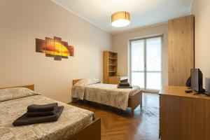 Ein Bett oder Betten in einem Zimmer der Unterkunft Maison Anselmo