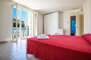 A bed or beds in a room at Residence Marina Salivoli