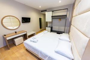 Postel nebo postele na pokoji v ubytování Delight Hotel
