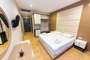 Postel nebo postele na pokoji v ubytování Delight Hotel