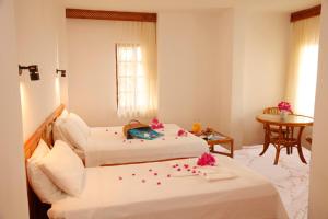 Кровать или кровати в номере Kekova Hotel