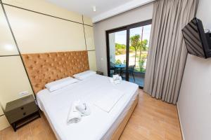 Postel nebo postele na pokoji v ubytování Delight Hotel