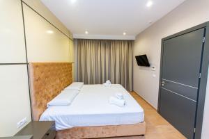 Postel nebo postele na pokoji v ubytování Delight Hotel
