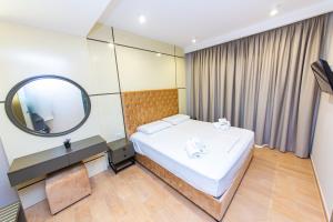 Postel nebo postele na pokoji v ubytování Delight Hotel