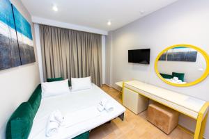 Postel nebo postele na pokoji v ubytování Delight Hotel