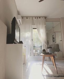 A television and/or entertainment centre at Stefanias sunny Acropolis Studio on Drakou pedestrian