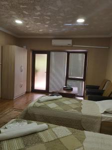 Letto o letti in una camera di Hotel Rabath