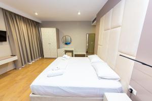 Postel nebo postele na pokoji v ubytování Delight Hotel
