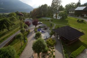 an aerial view of a house with a driveway at Hotel-Pension Birkenhof in Kötschach