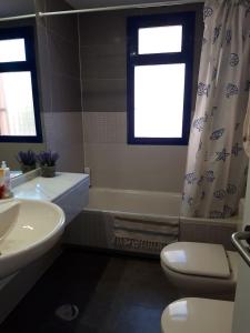a bathroom with a tub and a toilet and a sink at Apartamento de lujo, para relajarse en Mojácar in Mojácar