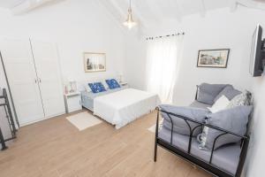 Łóżko lub łóżka w pokoju w obiekcie Vacation home Villa Santa Eufemia