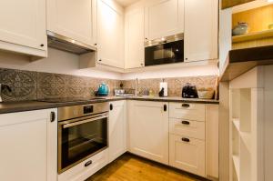 Kuchyňa alebo kuchynka v ubytovaní Apartament EmeryK