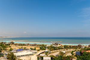 a view of a resort with the ocean in the background at Hotel St Gregory Park in Rimini
