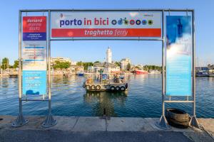 a sign with a boat in the water at Hotel St Gregory Park in Rimini