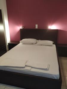 Voodi või voodid majutusasutuse Mavroforos Hotel toas
